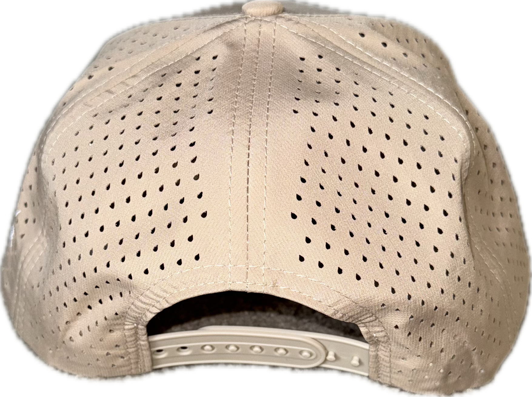 5 panel hat with snapback adjustability that is moisture wicking. Tan color, view of back.