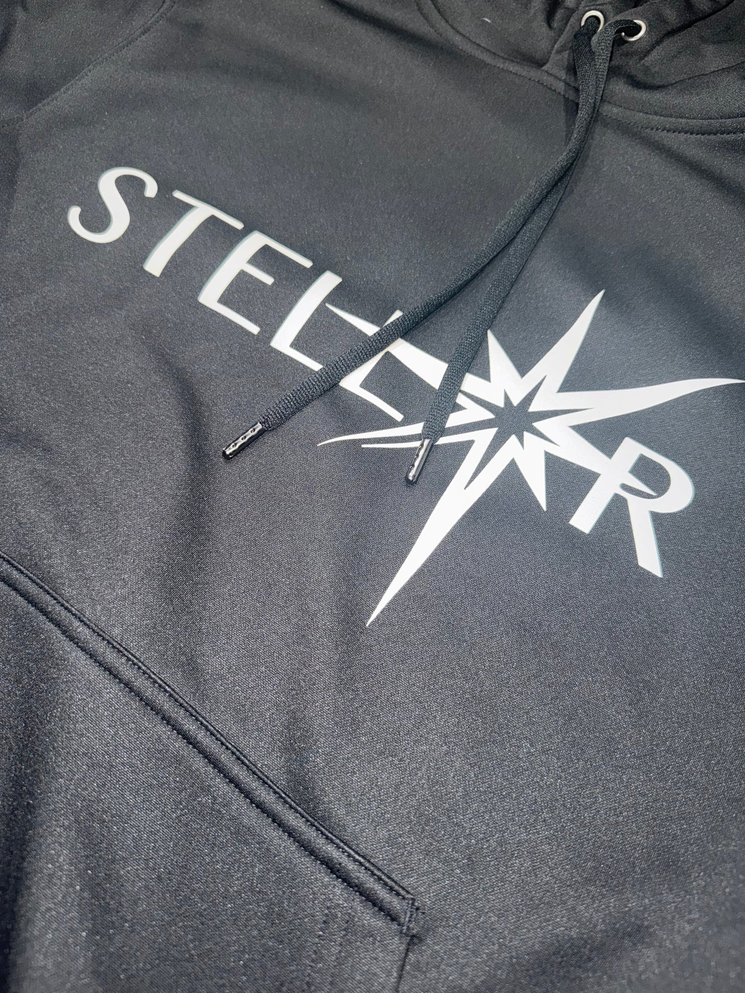 Black hoodie with 'STELLAR' print on the front, stylish and comfortable addition to any wardrobe. Hoodies.