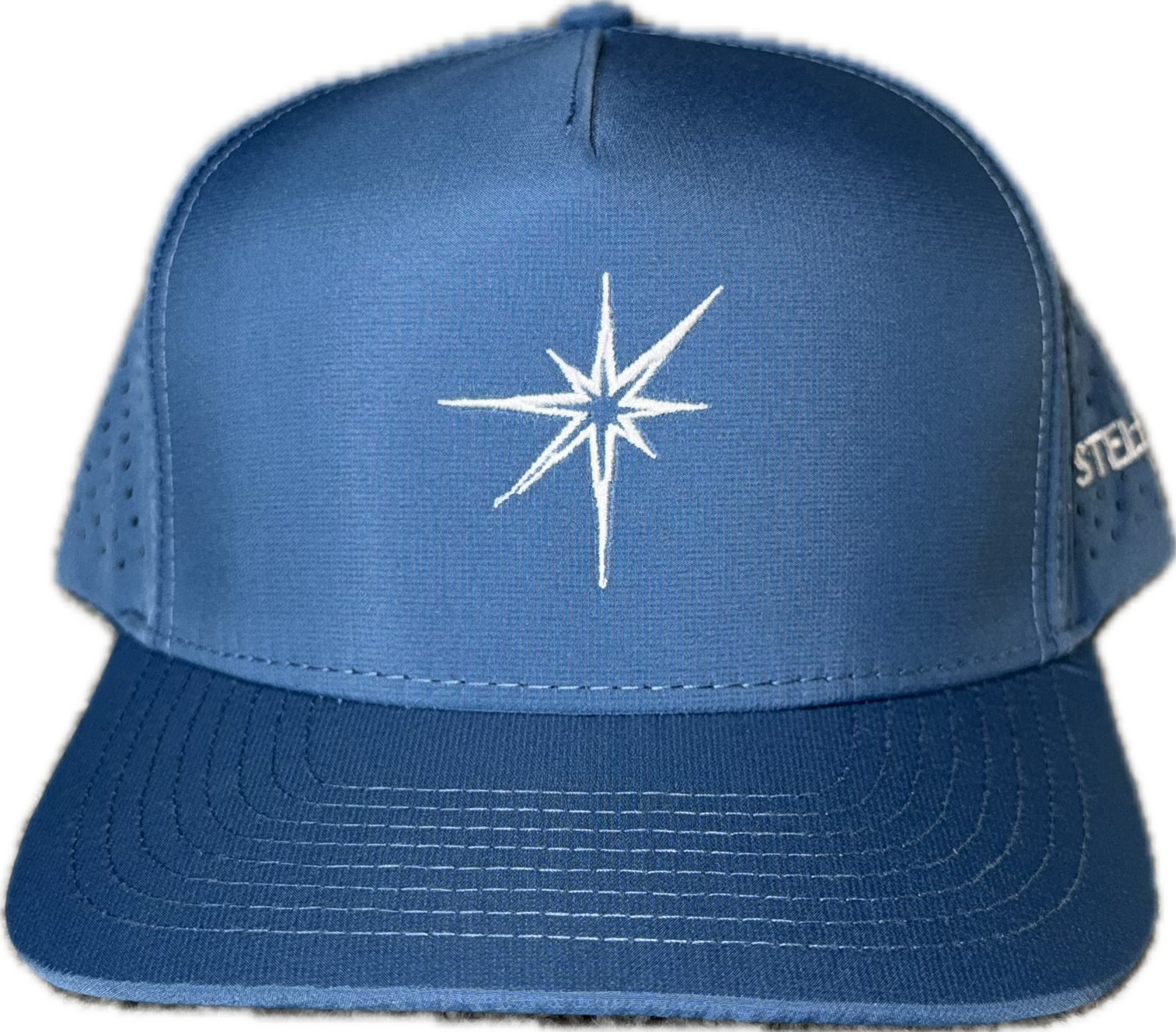 5 panel hat with snapback adjustability that is moisture wicking. Sky blue color, front view.